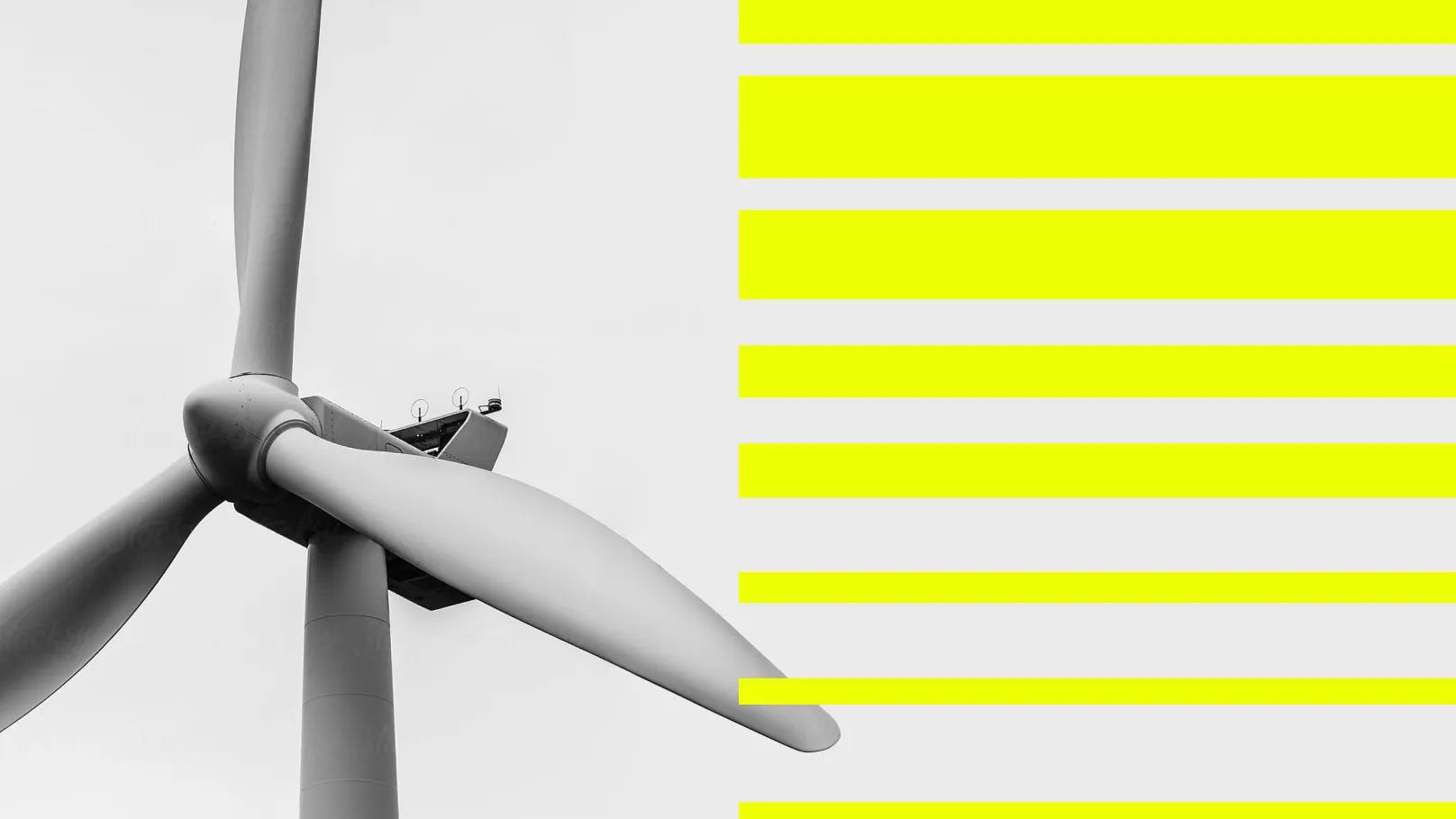 Black-and-white wind turbine next to yellow stripes