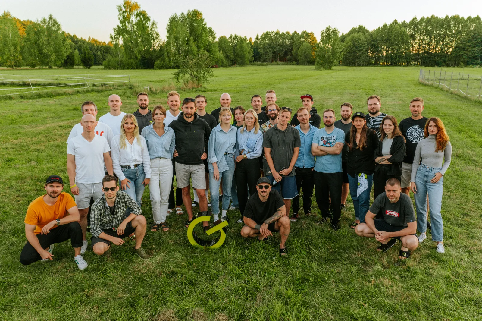 Order Group team group photo on a meadow during the 2023 workation