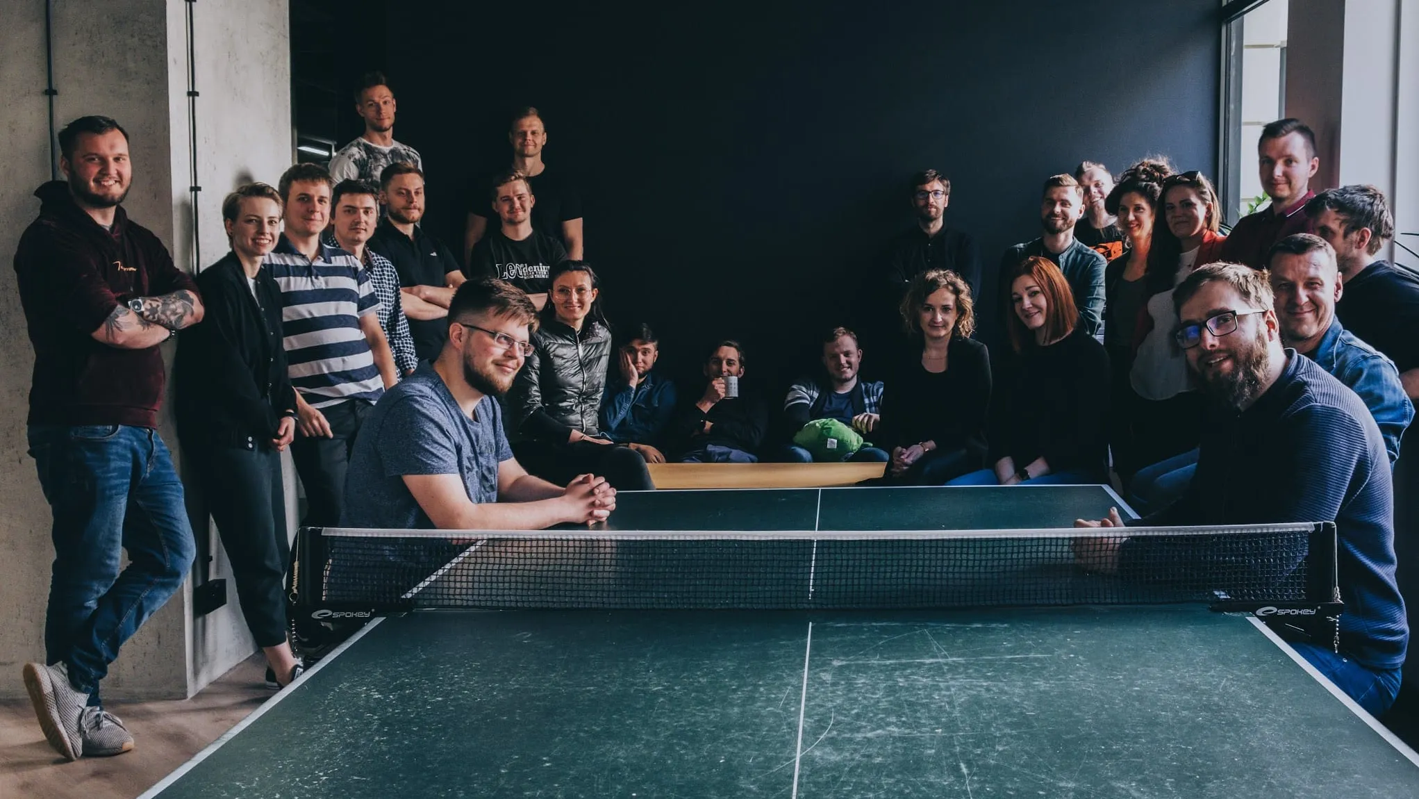 Order Group team group photo around a table tennis table