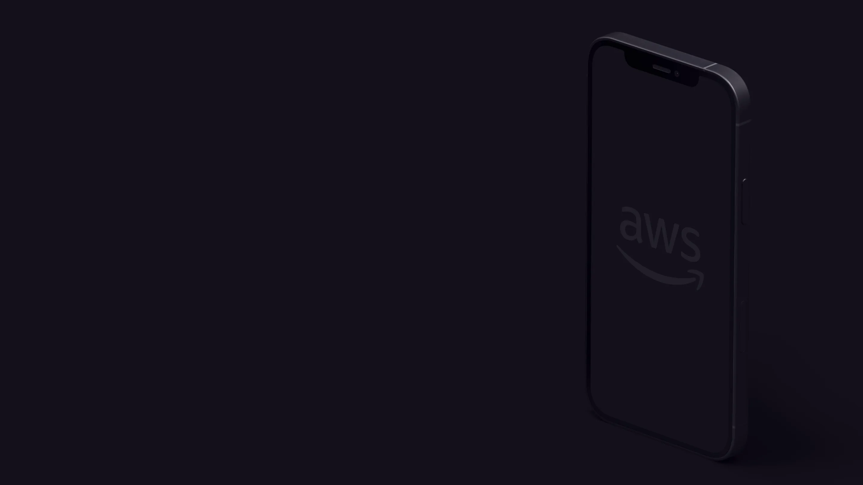 Smartphone in the dark with a faint AWS logo