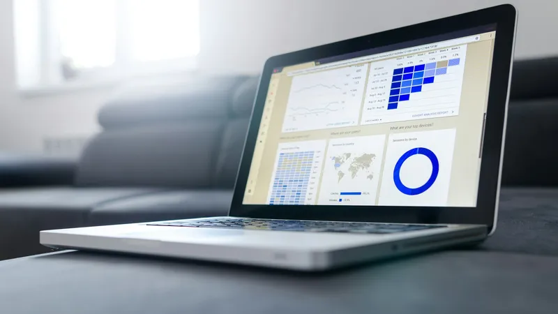 Laptop showing an analytics report with charts (Unsplash free license)