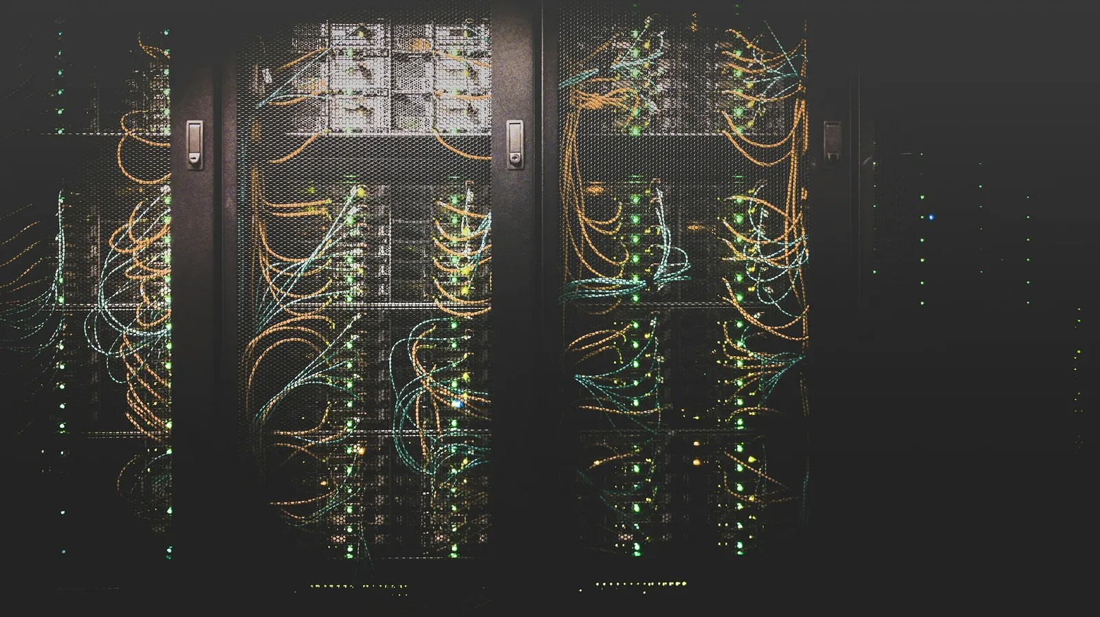 Server racks with network and fibre cables in a data centre